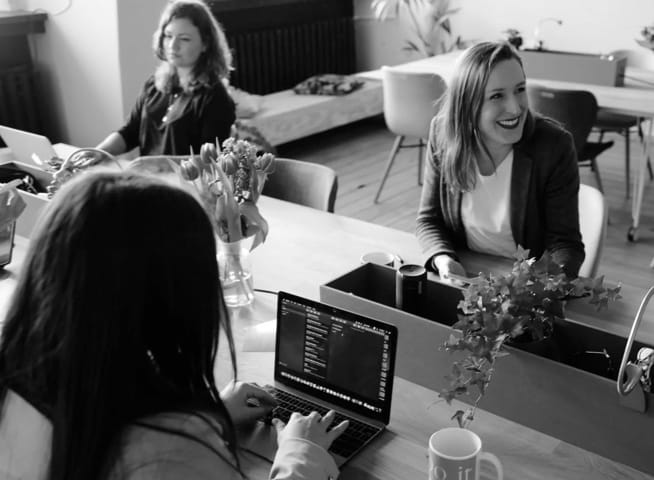 office workers using laptops